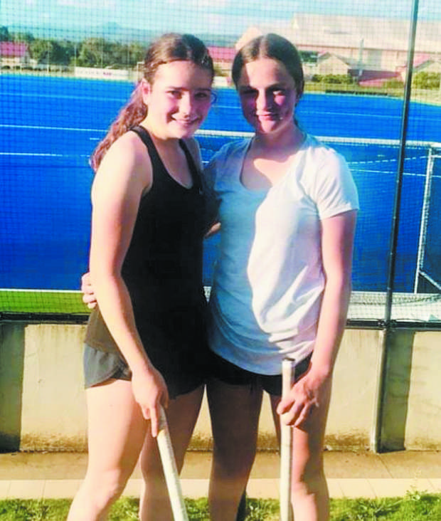 Olivia Coombes and Molly Collett on the hockey field